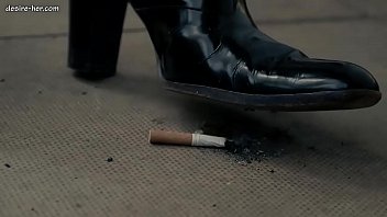 Mistress angela smokes cigarette leather
