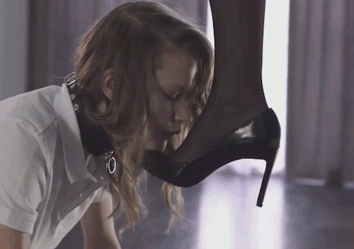 Beautiful slave girl licking
