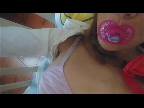 Summer sucks pacifier while diapered fan image