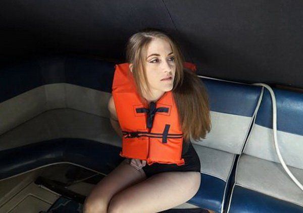 Bondage girl on boat